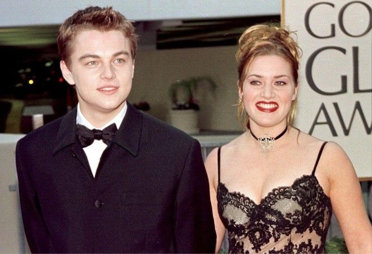 BEVERLY HILLS, CA - JANUARY 18: Actor Leonardo DiCaprio (L) arrives with actress and Titanic co-star Kate Winslet for the 55th Annual Golden Globe Awards at the Beverly Hilton 18 January 1998 in Beverly Hills, CA. DiCaprio is nominated for Best Actor in the drama category for his role in "Titanic". "Titanic" is also nominated for Best Picture, Best Director and Best Actress in the same category. (Photo credit should read HAL GARB/AFP/Getty Images)